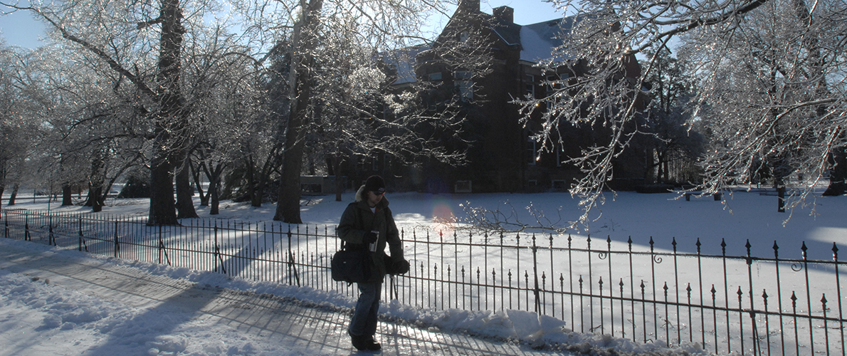 man walking on Carbondale campus in the winter weather